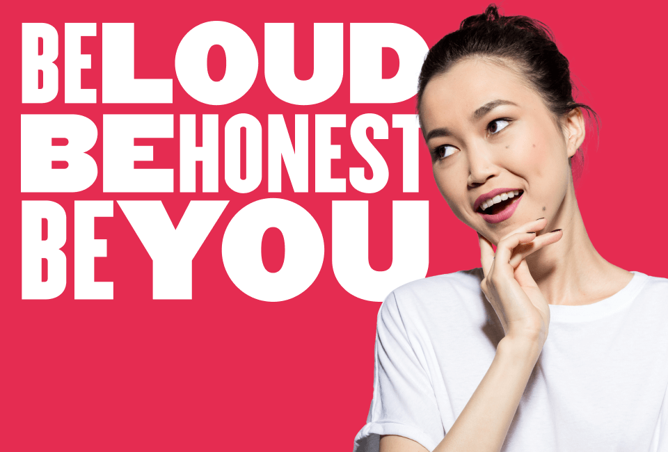 loud honest empowerment message with young woman in white shirt, bright pink background, confident female portrait encouraging self-expression