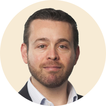 professional man with beard in circular frame, business portrait with neutral background