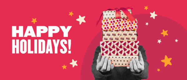 happy holidays message, stack of colorful gift boxes on a bright pink background with stars and festive designs