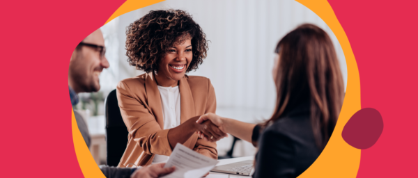 business meeting, professional handshake with smiling woman in modern office setting