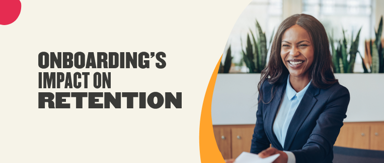 onboarding impact on employee retention, smiling professional in business attire holding documents in an office setting