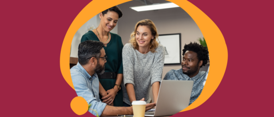 collaborative team meeting, diverse professionals working on a laptop in a modern office setting