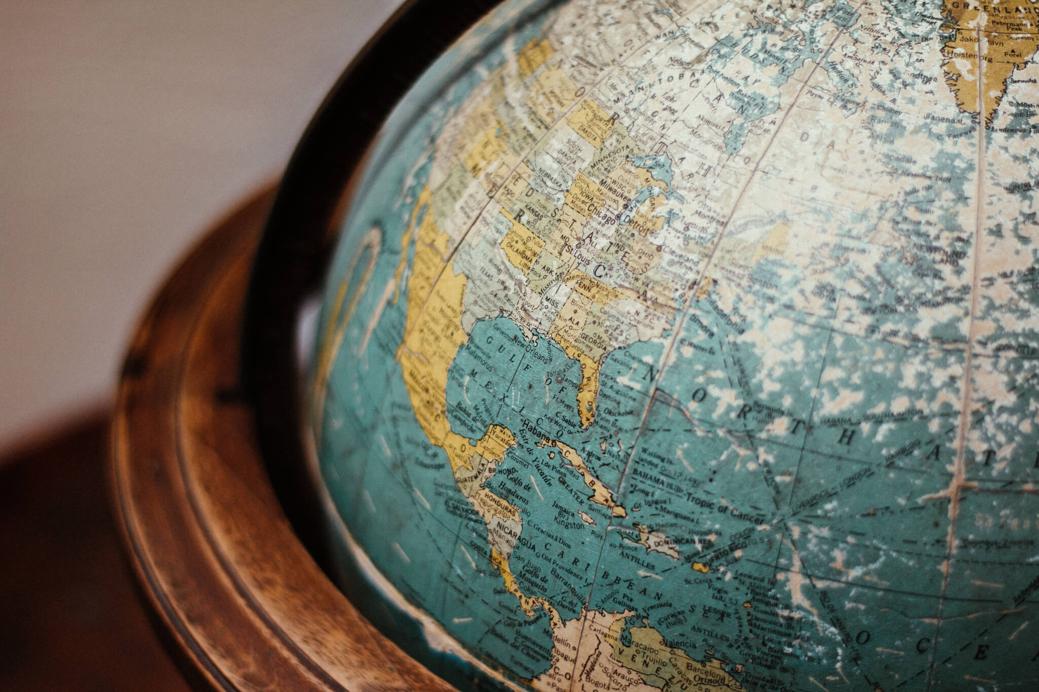 vintage globe with detailed map of North America and the Caribbean, showcasing geographic features and textures, historic educational globe with rich colors and intricate land details, illustrating geography and exploration